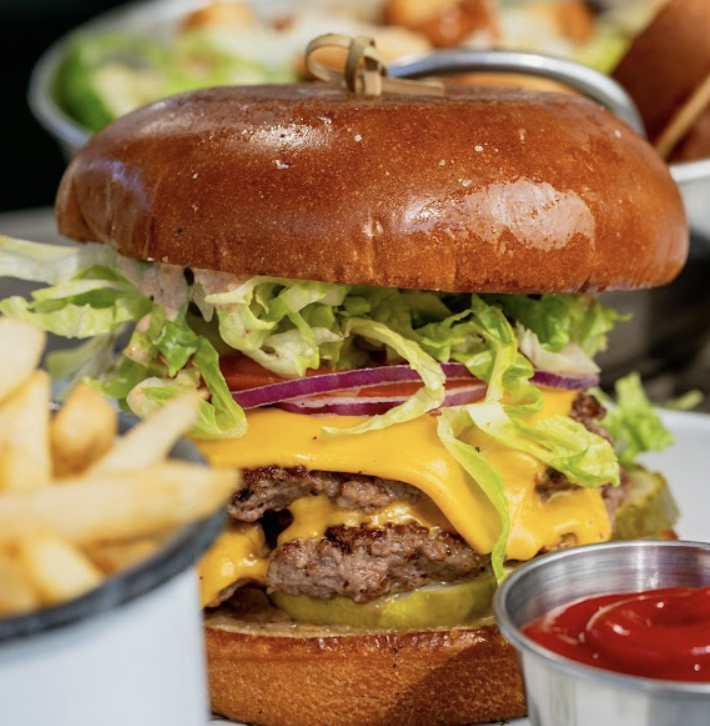 Camp Outpost signature dishes Camp BurgerMission SaladFried Chicken Sandwich